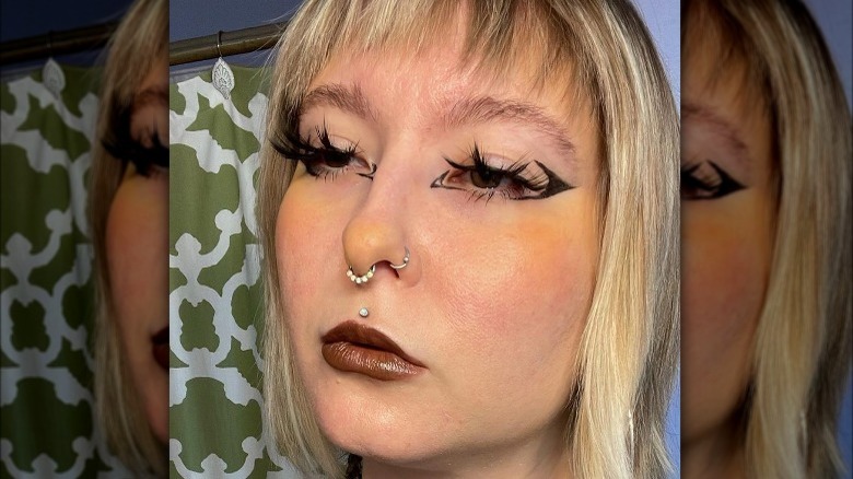 Woman with yellow blush and black liner