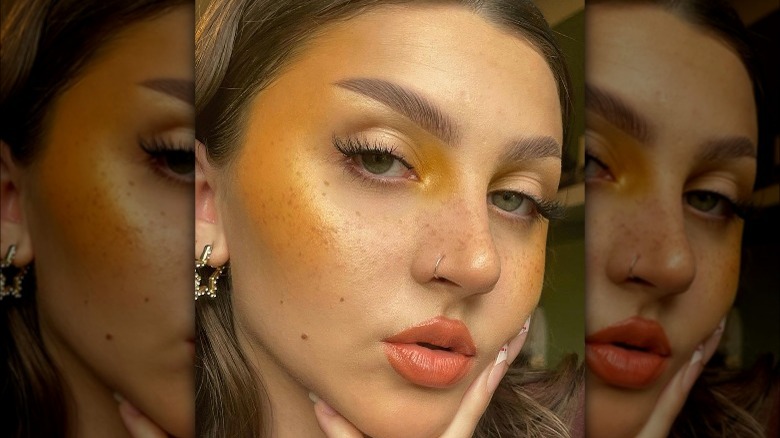 Woman with yellow glowy blush