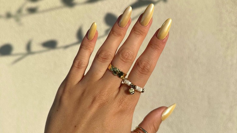 Gold yellow chrome manicure nails