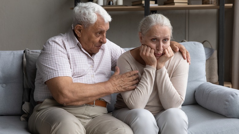 Older couple sitting on couch 