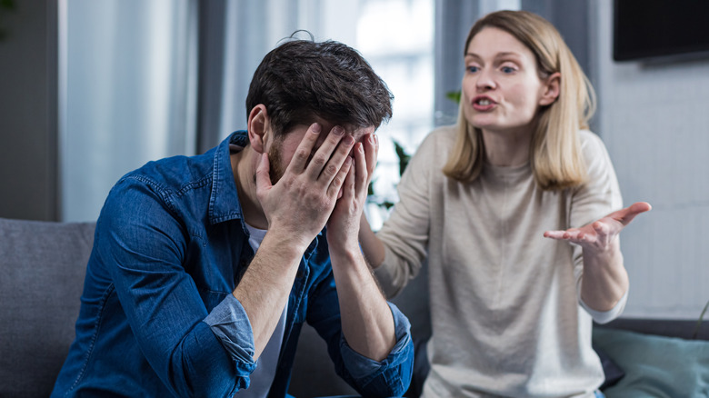 Couple having argument on couch