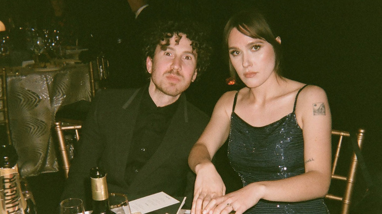 Eden Brolin and Cameron Crosby sitting at a table together.