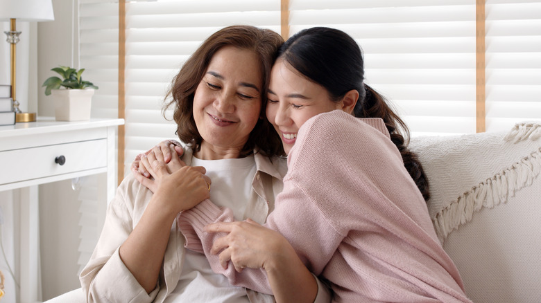 Mother and daughter hug