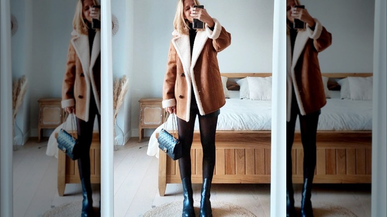 Girl wearing shearling lined peacoat.