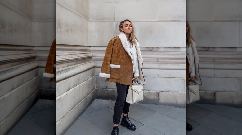 Influencer wearing brown suede jacket 