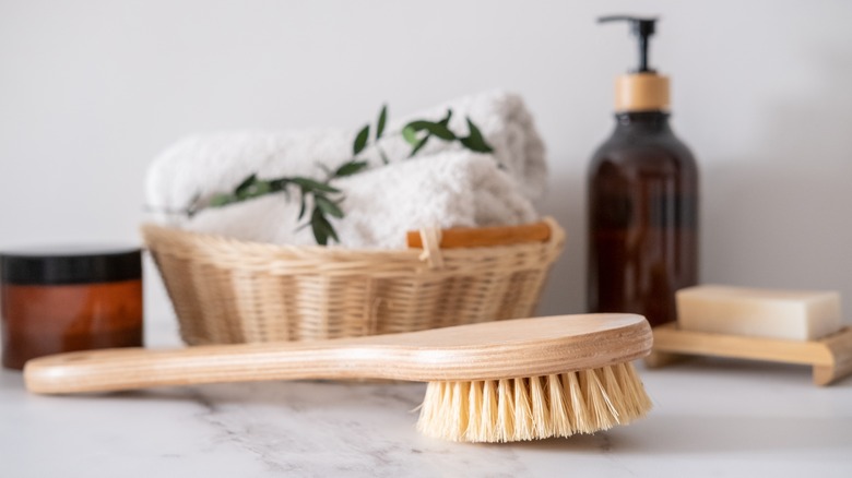 wooden dry brush with soap in background