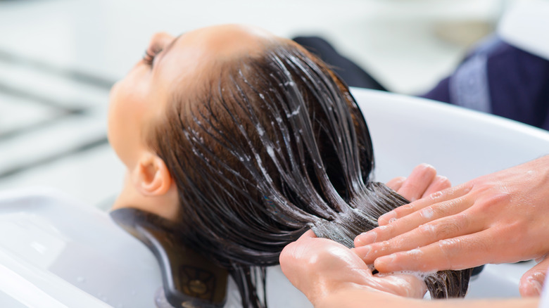 woman getting shampooed at the salon