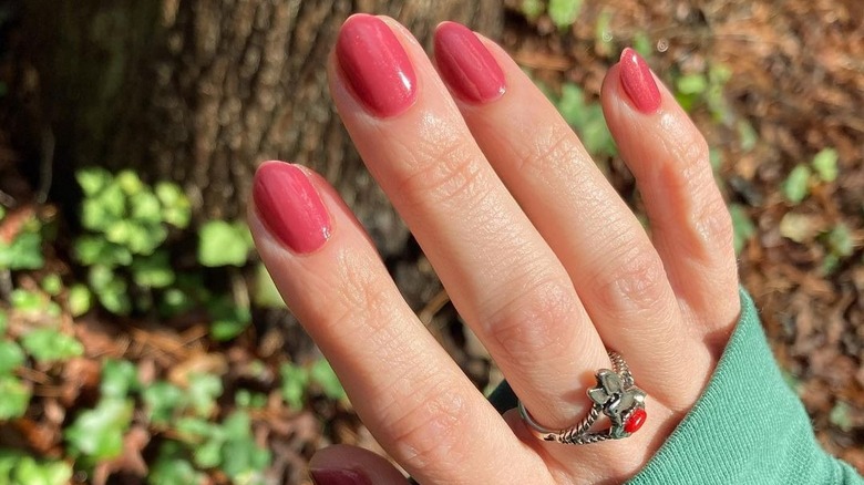 hand with coral nails