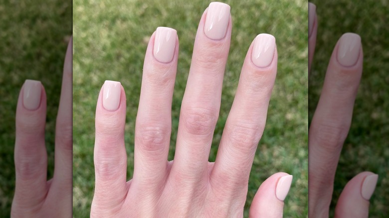 hand with nude nail polish