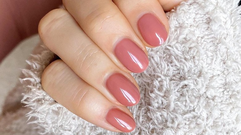 mauve nails with fuzzy sweater