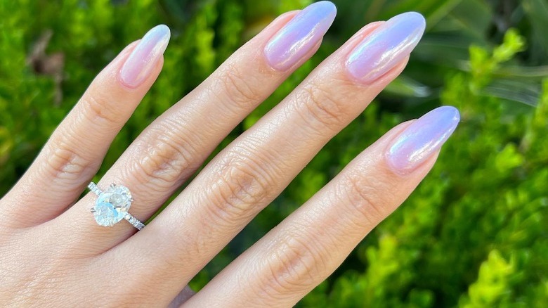 Hand with purple nail polish