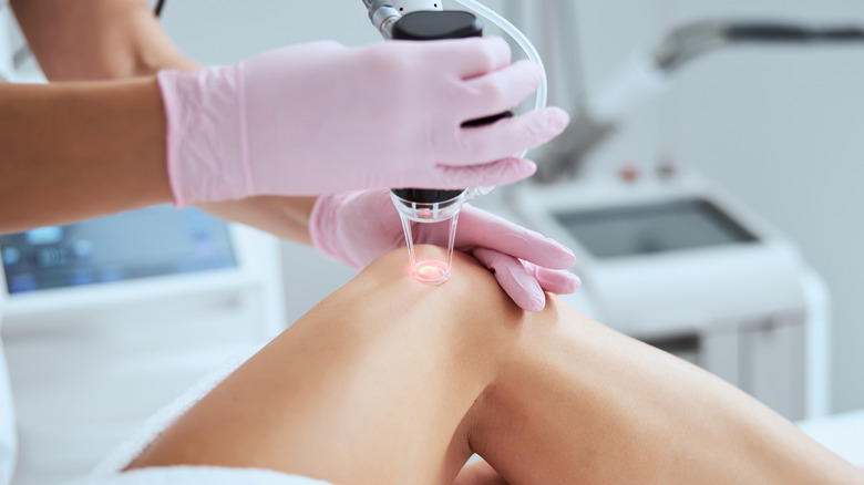 closeup of doctor treating leg veins