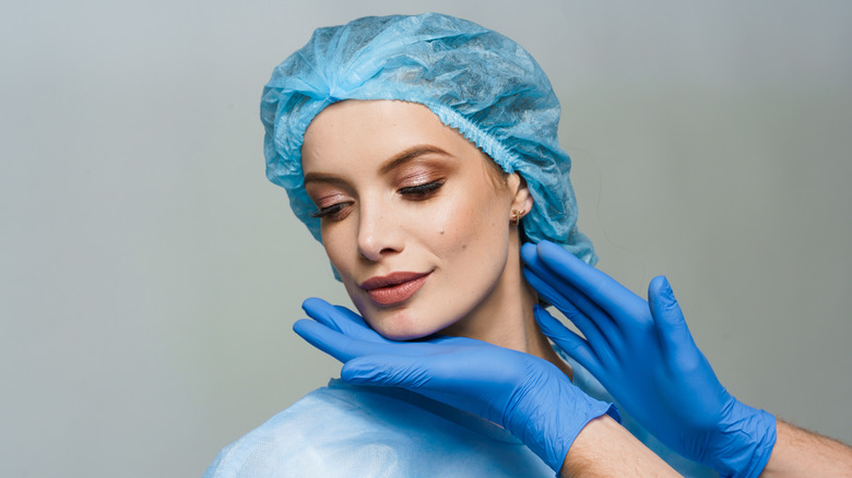 surgeon analyzing chin filler results