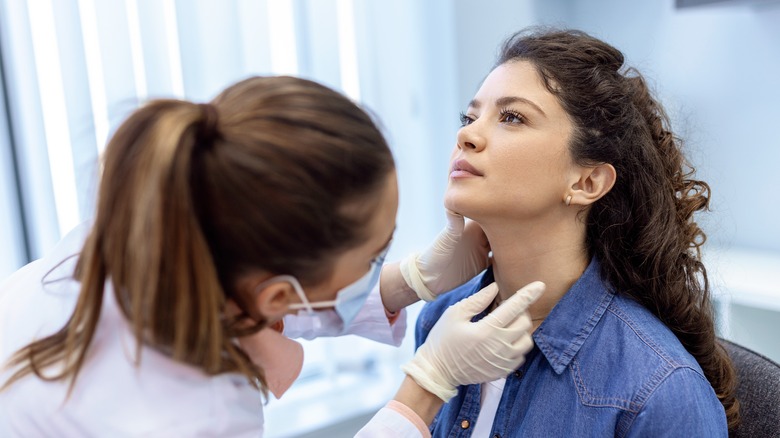 Woman being examined by endocrinologist