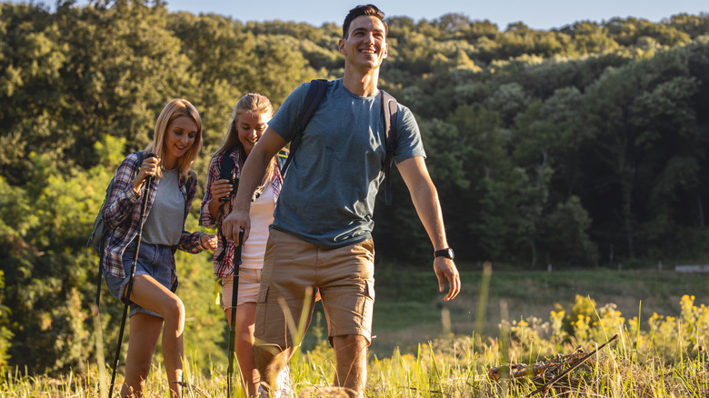 People Nordic walking and smiling