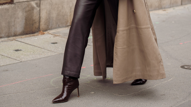 person wearing brown stiletto boots
