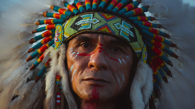 Native American man wearing headdress