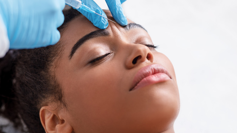 woman getting botox in forehead