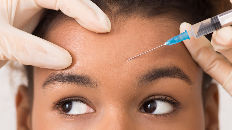 woman getting botox in forehead