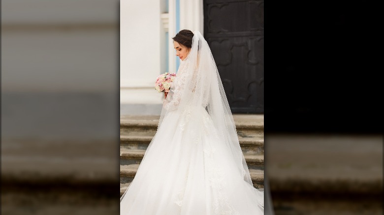 Bride wearing a chapel-length veil 