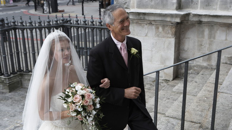 Bride walking with her father