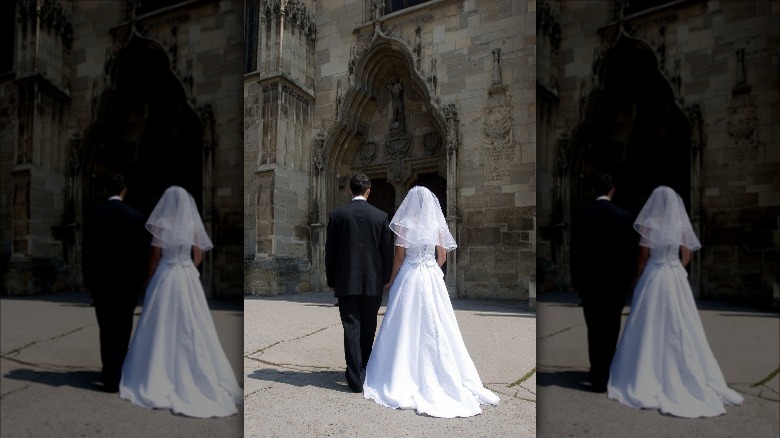 Bride, groom walking to church