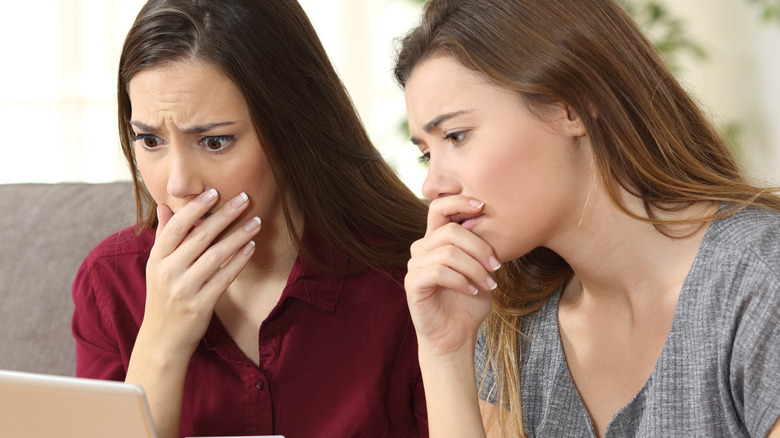 two woman in shock