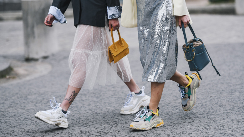 parisians wearing dresses with sneakers