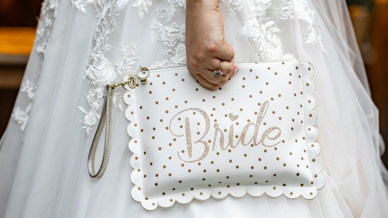 bride holding bag