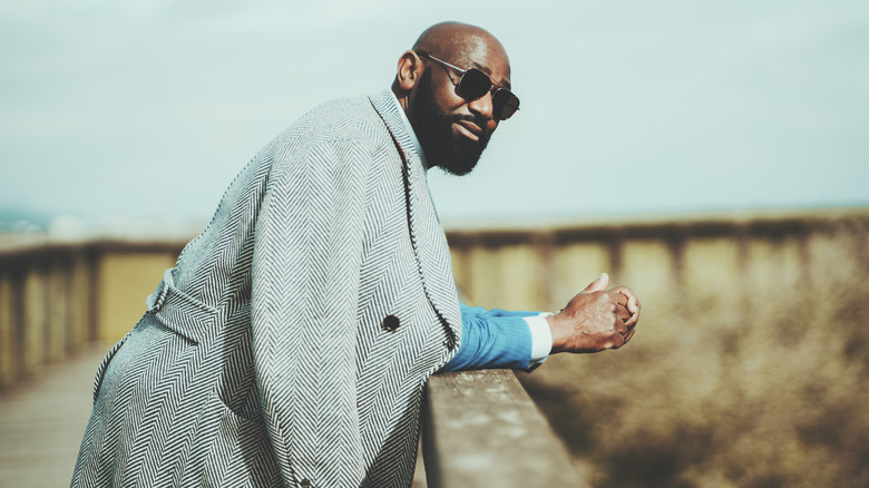 stylish man wearing tailored trench