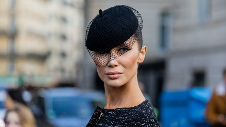 woman wearing black beret with net