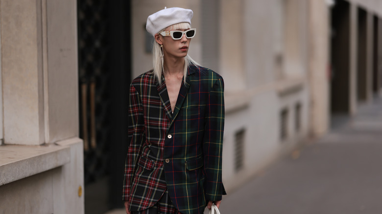 woman wearing white beret and plaid blazer