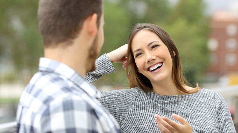 woman on a date laughing