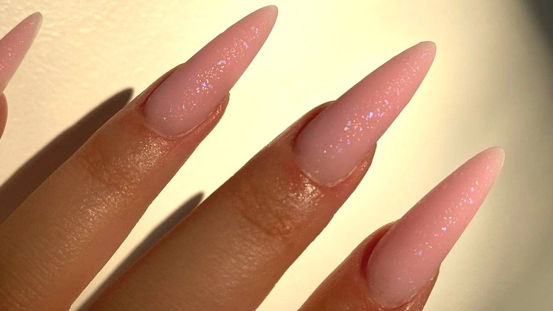 Woman with shimmering nails
