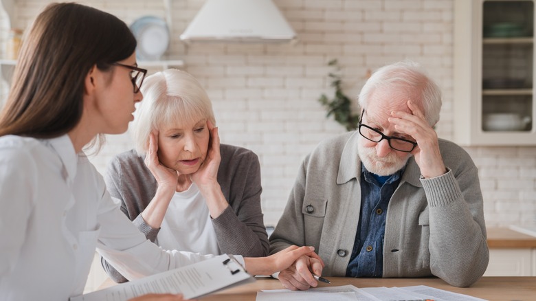 Three people sitting at table 