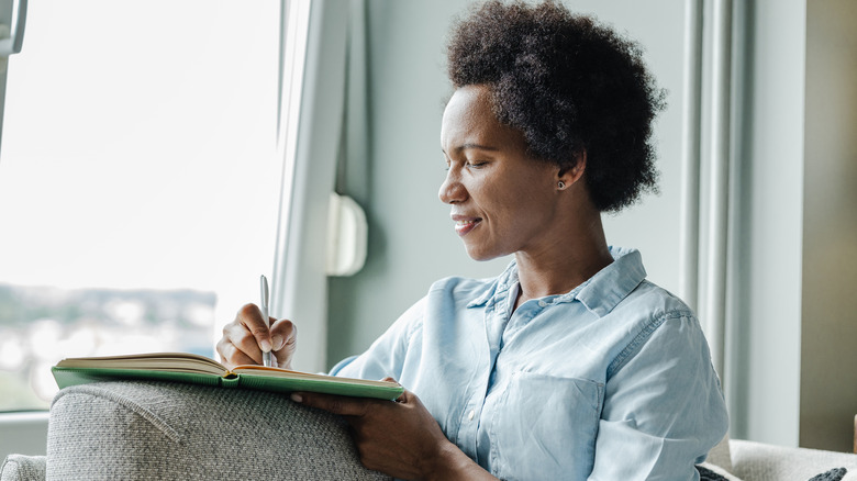 Woman writes in journal