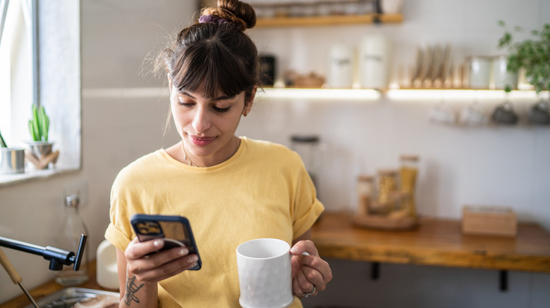 Woman checks phone 