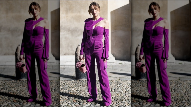 Woman in dramatic purple pantsuit 