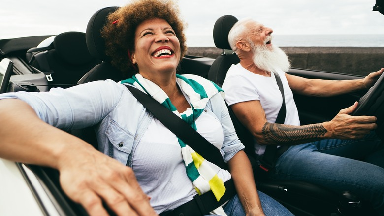 A couple in a convertible 