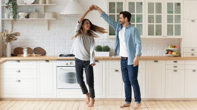 Couple dancing in kitchen