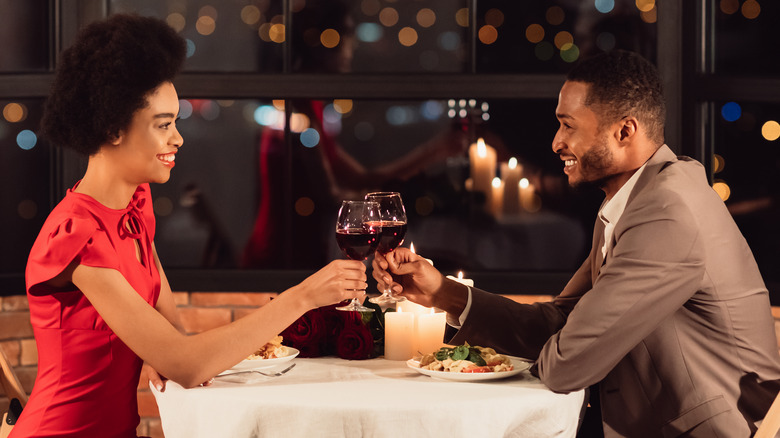 Couple smiling on dinner date