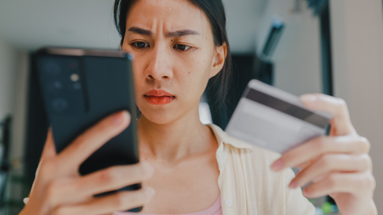 Woman checking credit card balance 
