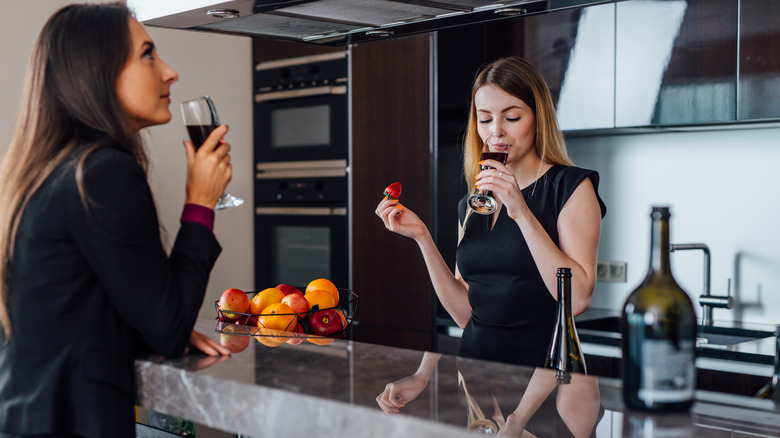 Women sipping wine together