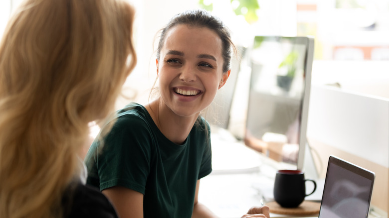 Two young women talking