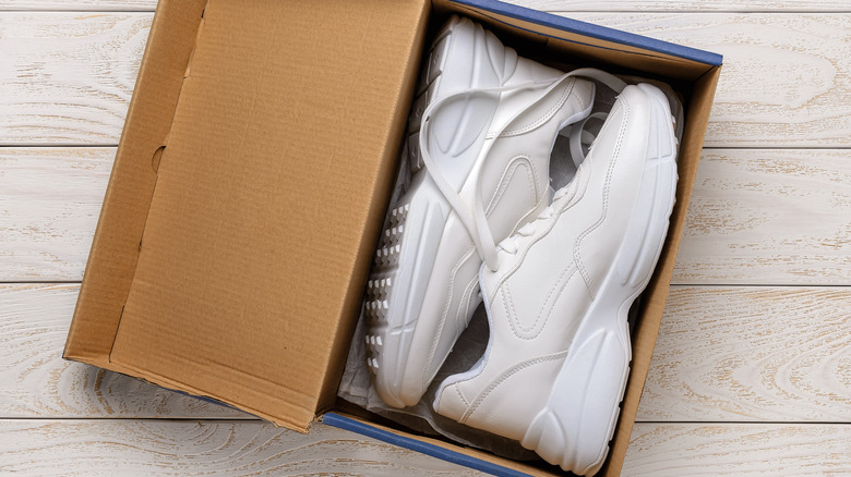 white chunky sneakers in a shoe box