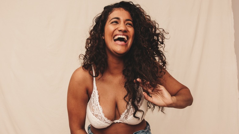 laughing woman in bra