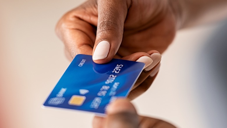 woman paying with card