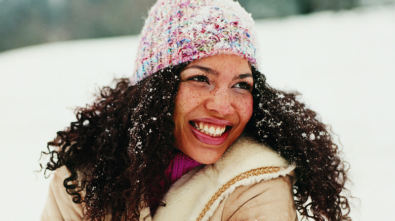 smiling woman in snow 