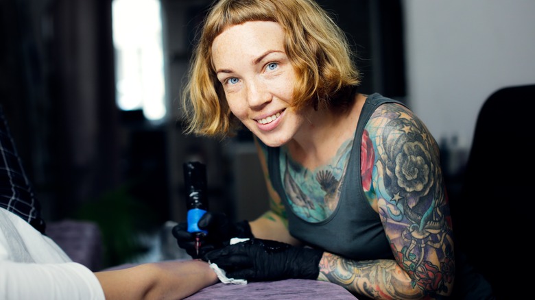 tattoo artist smiling