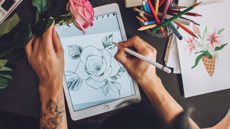 woman creating tattoo design